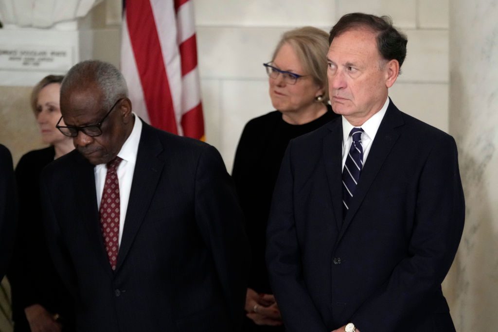 Supreme Court Justices Clarence Thomas and Samuel Alito attend a private ceremony for retired Supreme Court Justice Sandra Day O'Connor before public repose in the Great Hall at the Supreme Court on Dec. 18, 2023 in Washington, DC. (Photo by Jacquelyn Martin-Pool/Getty Images)