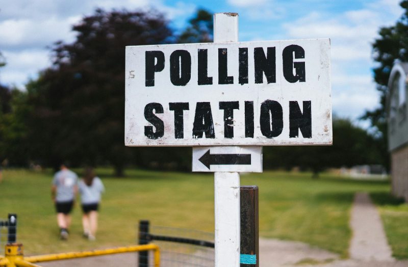 White polling station sign.