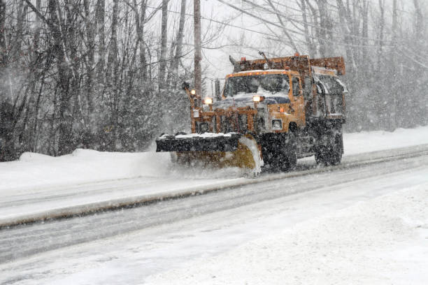 Big Municipal plow truck plowing snow off roadways in Laconia, New Hampshire USA. (Via Getty Images)