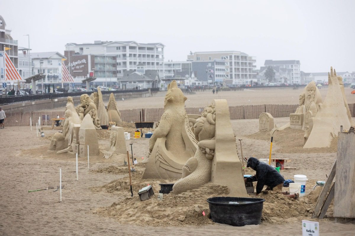 sculptor working at the Hampton Beach Sand Sculpting Classic