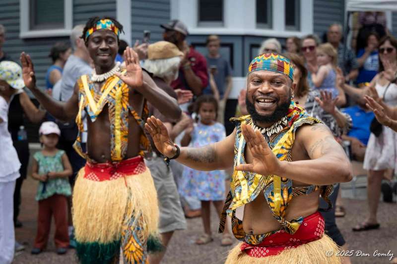 Men in traditional African garb take part in a Juneteenth parade
