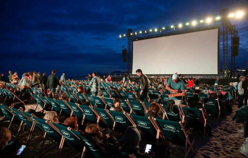 A crowd gets seated before a free outdoor movie night in New Hampshire