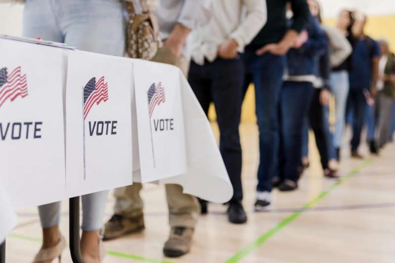 Voters in line to cast their ballot at the polls. Via Getty Images